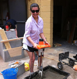 Student Elena Destefano works on the urdan garden for the Mantua Presbyterian Apartments